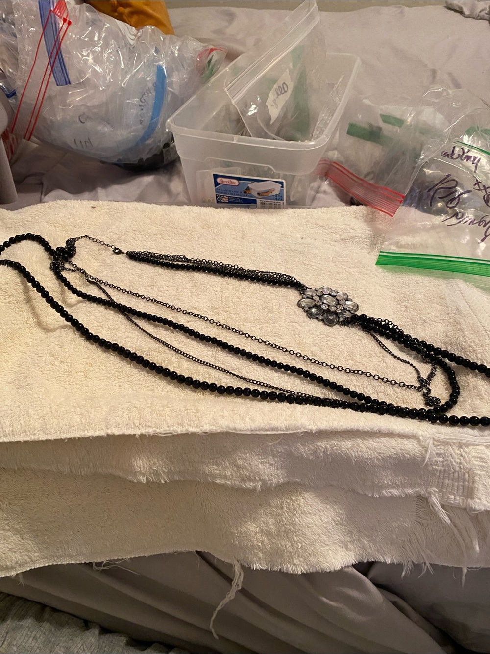 Multi-Strand Black Bead Necklace with Crystal Flower Accent
